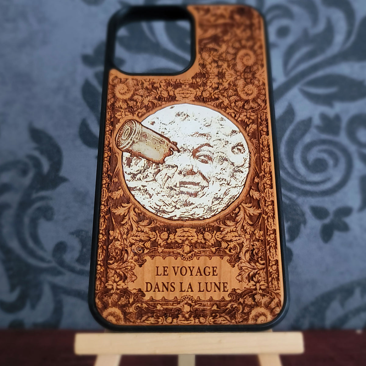 Antique style lunar artwork laser engraved into natural cherrywood phone case
