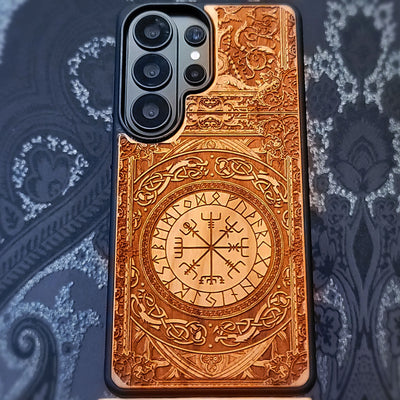 Deep laser engraved wooden phone case featuring the Vegvisir Viking compass with Nordic runic symbols for iPhone and Samsung Galaxy models.