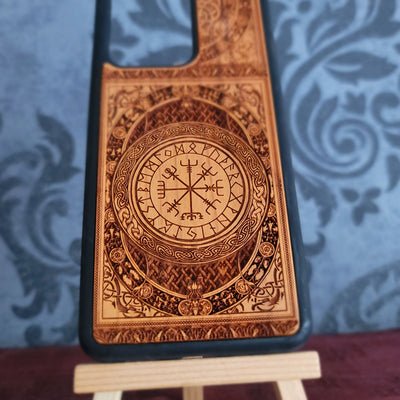 Handcrafted cherrywood phone case with detailed Nordic magical stave design