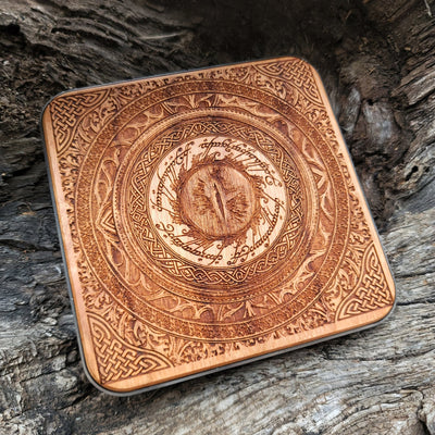 Wooden wireless charger featuring Lord of the Rings Eye of Sauron.