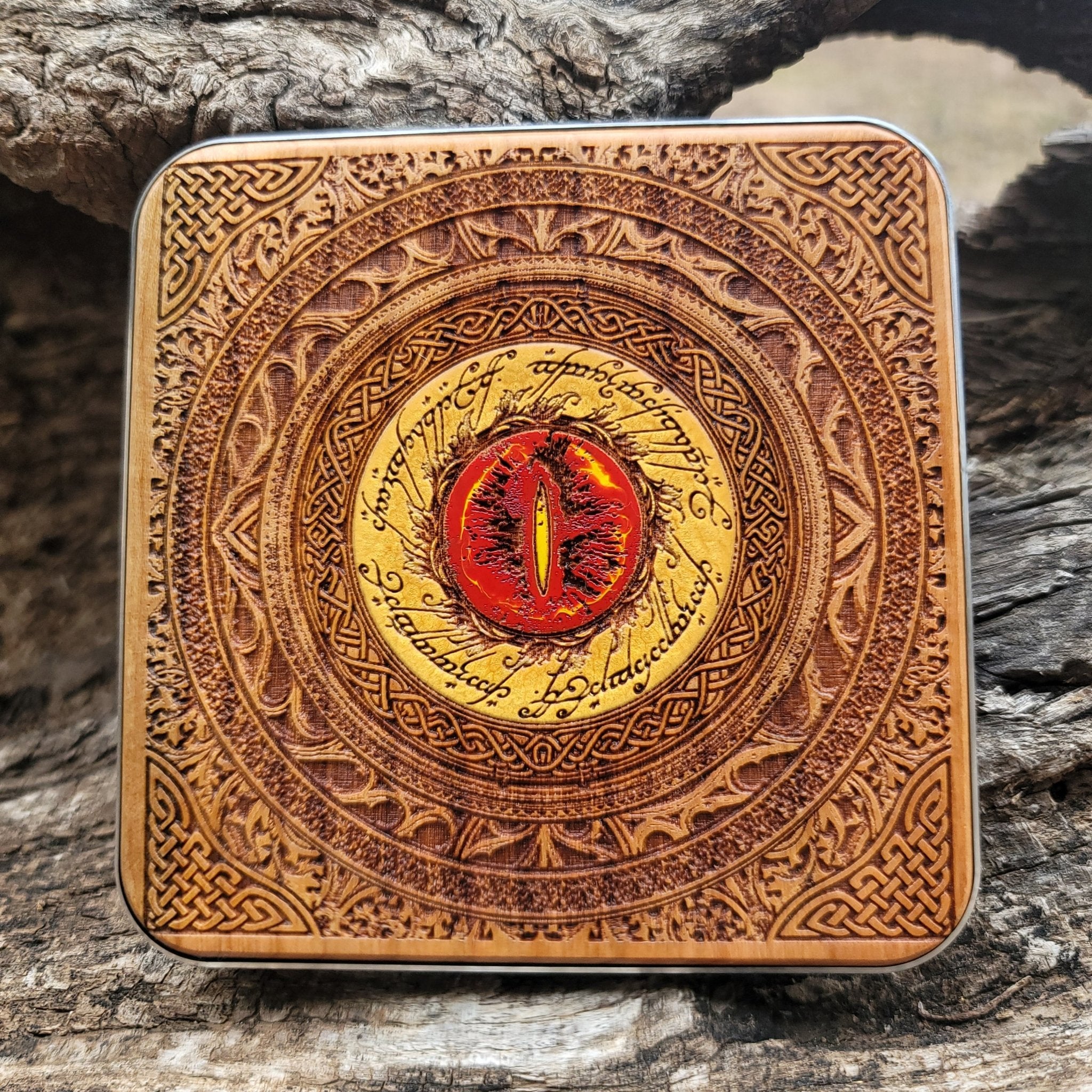 Artisan wooden charger with glowing Eye of Sauron artwork.