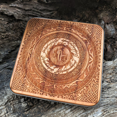 Overhead view of Eye of Sauron artwork on wooden wireless charger.