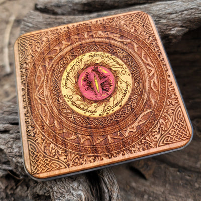 Tolkien-inspired wireless charger featuring Mordor's iconic symbol.