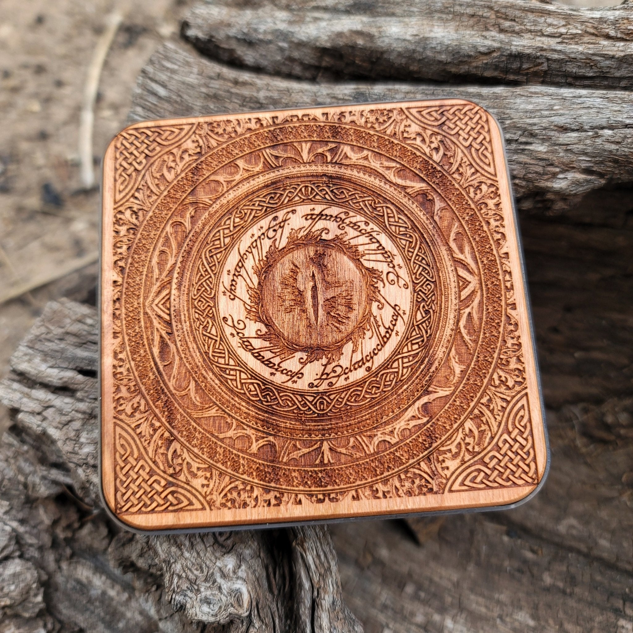 Dark fantasy wireless charger with glowing Eye of Sauron art.