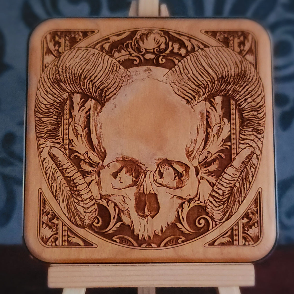 Gothic skull desk accessory made from engraved cherry wood with wireless charging
