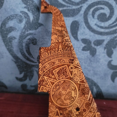Engraved wood guitar scratchplate with intricate Aztec inspired geometric design