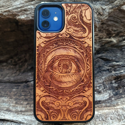 Wooden phone case with an intricate human eye design, featuring detailed gothic art. Compatible with iPhone , iPhone 15, Galaxy S23 Ultra, Note 20, and more. Ideal for lovers of dark fantasy and custom phone accessories.
