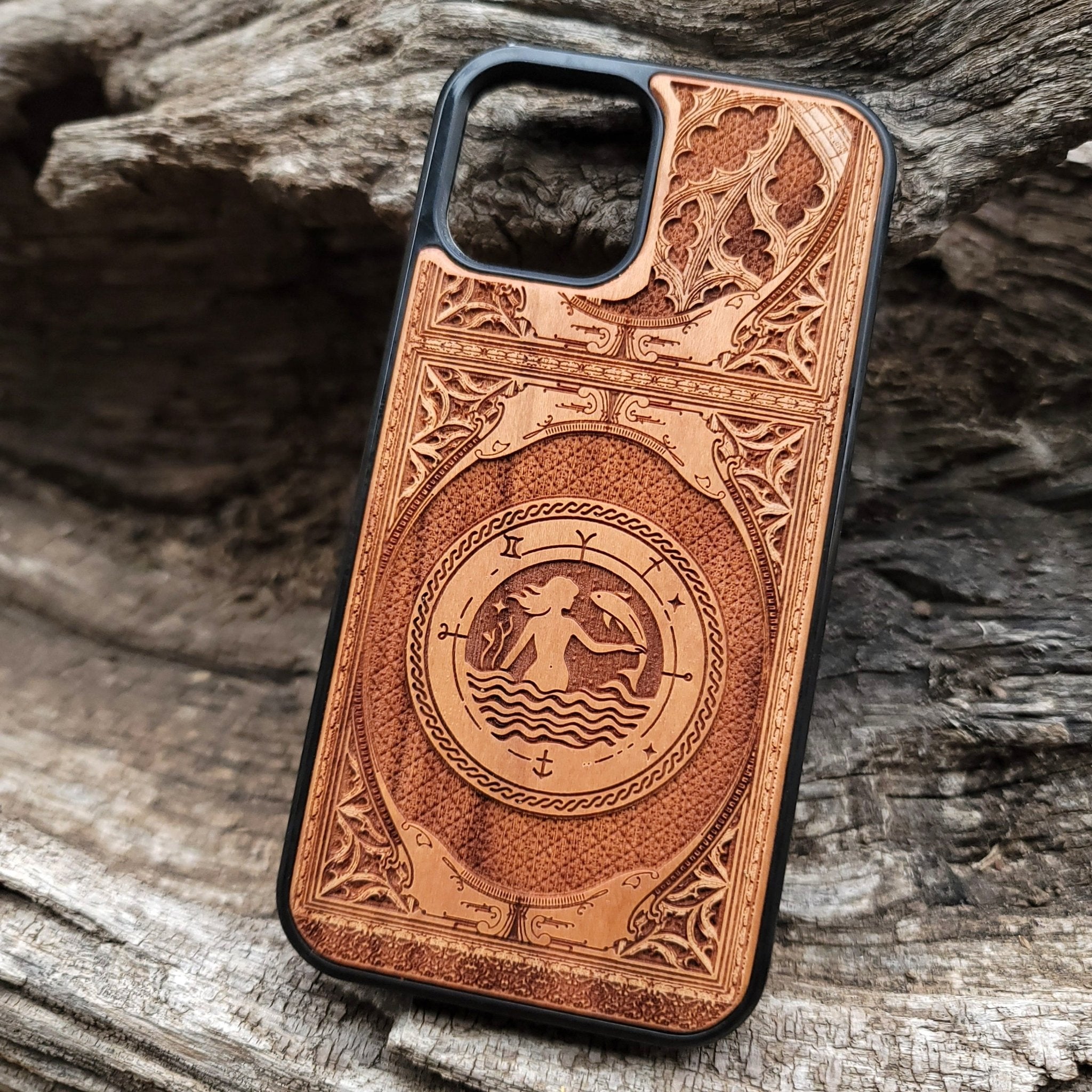 Intricate gothic skeleton artwork engraved on a wooden phone case, compatible with iPhone  and Samsung Galaxy S.