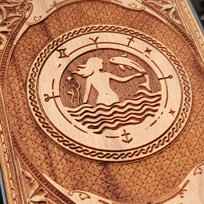 Intricate gothic skeleton artwork engraved on a wooden phone case, compatible with iPhone  and Samsung Galaxy S.