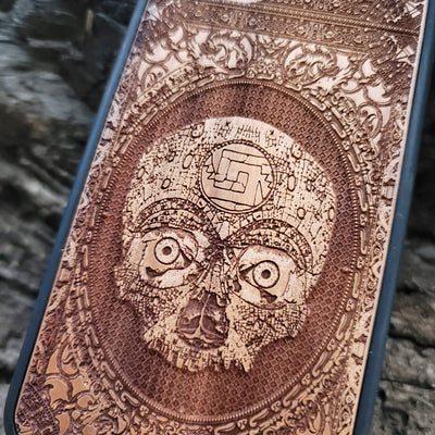 Aztec Skull wooden phone case featuring a detailed laser-engraved design. Compatible with iPhone , iPhone 15, Galaxy S, Note 20, and other popular models. Ideal for fans of gothic, dark, and ancient art designs