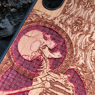 Hand-painted cherry wood phone case with Gothic skeleton engraving, designed for iPhone & Samsung Galaxy models.