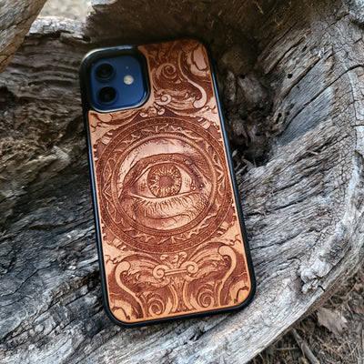 Wooden phone case with an intricate human eye design, featuring detailed gothic art. Compatible with iPhone , iPhone 15, Galaxy S23 Ultra, Note 20, and more. Ideal for lovers of dark fantasy and custom phone accessories.