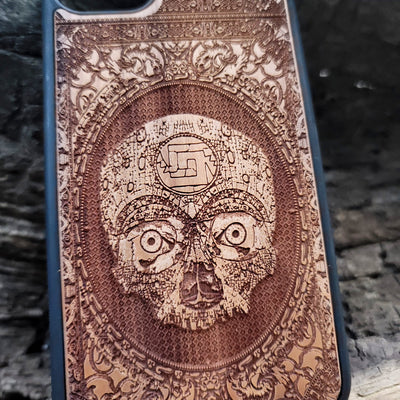 Aztec Skull wooden phone case featuring a detailed laser-engraved design. Compatible with iPhone , iPhone 15, Galaxy S, Note 20, and other popular models. Ideal for fans of gothic, dark, and ancient art designs