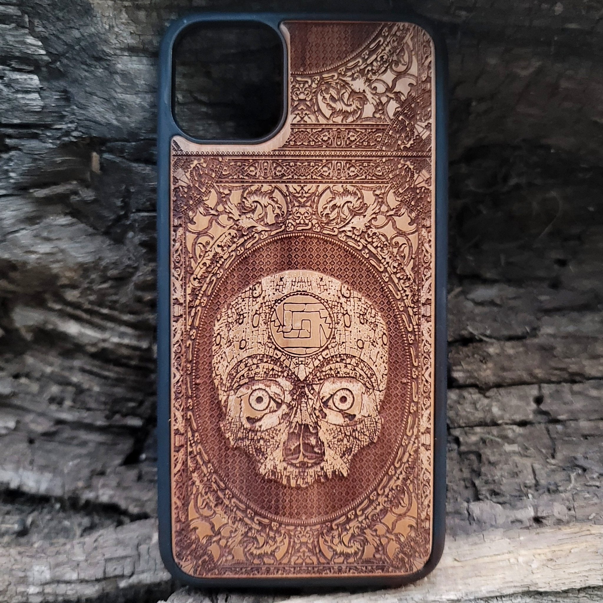 Aztec Skull wooden phone case featuring a detailed laser-engraved design. Compatible with iPhone , iPhone 15, Galaxy S, Note 20, and other popular models. Ideal for fans of gothic, dark, and ancient art designs