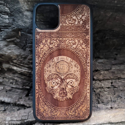 Aztec Skull wooden phone case featuring a detailed laser-engraved design. Compatible with iPhone , iPhone 15, Galaxy S, Note 20, and other popular models. Ideal for fans of gothic, dark, and ancient art designs