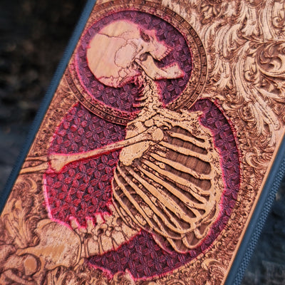 Hand-painted cherry wood phone case with Gothic skeleton engraving, designed for iPhone & Samsung Galaxy models.