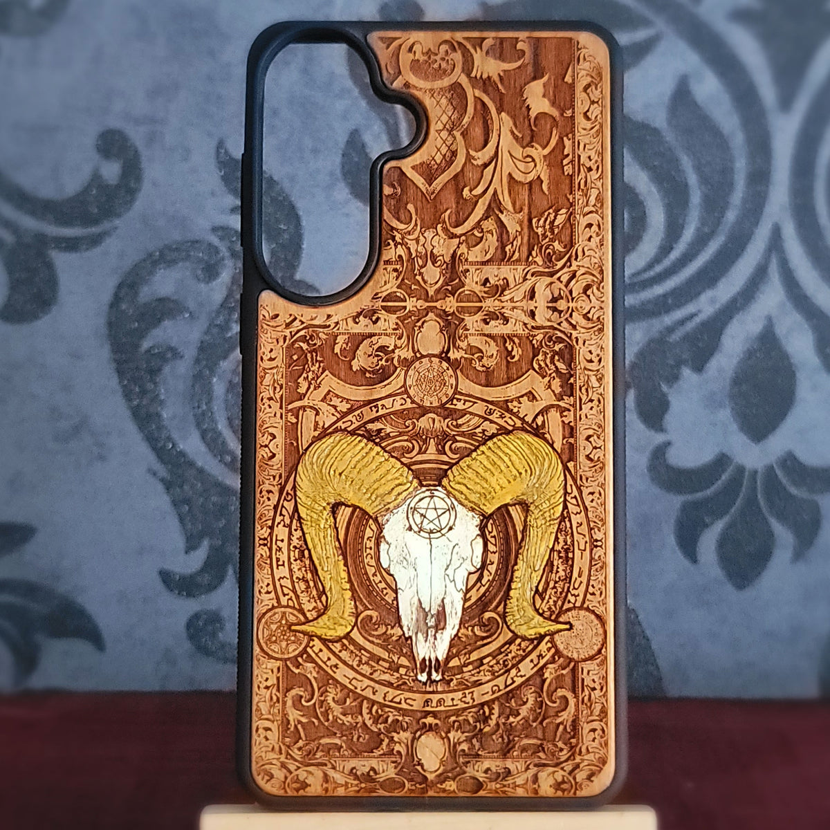 Baphomet engraved wood phone case with detailed horned goat occult design