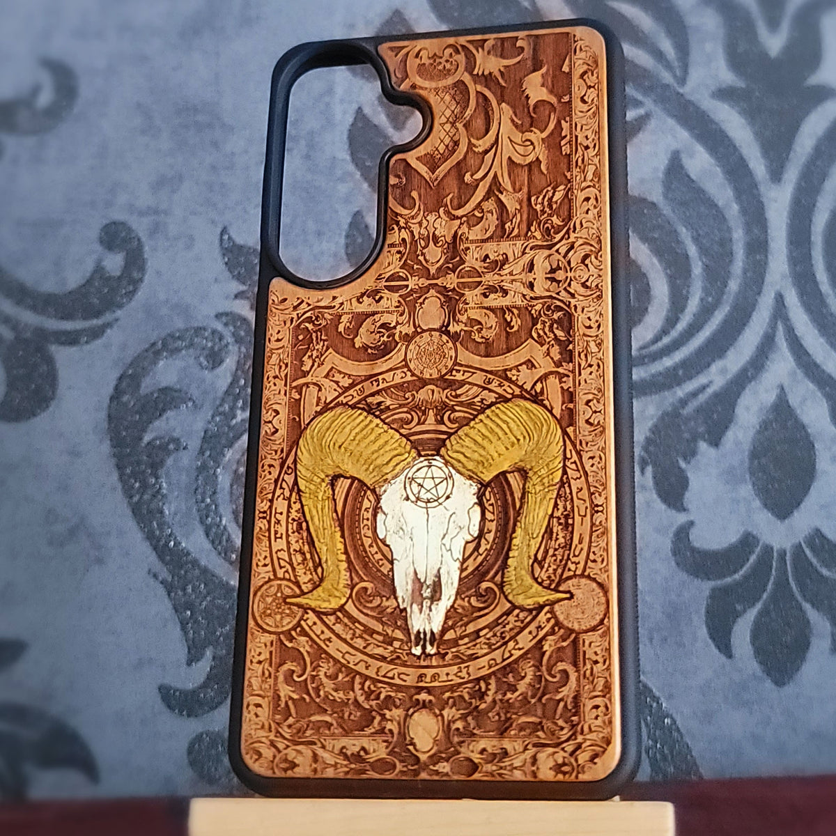 Natural cherrywood phone case featuring detailed Baphomet occult engraving