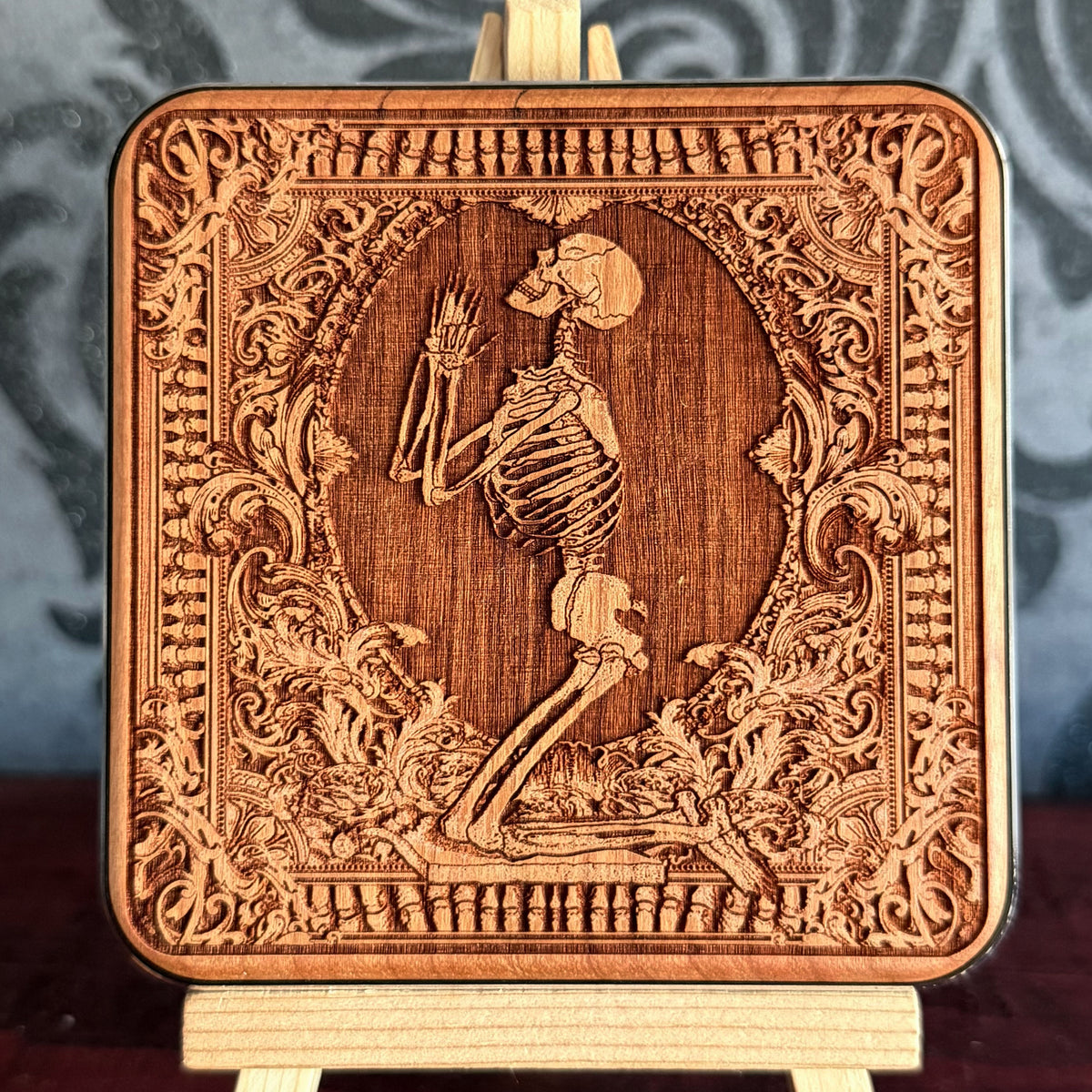 Praying skeleton laser engraved on real cherrywood wireless charger with ornate gothic frame