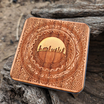 Close-up of Fellowship silhouette on hand-painted wood charger.