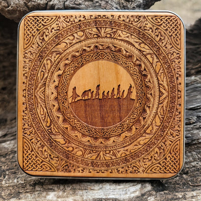 Dark wood wireless charger with Middle-earth fantasy symbols.