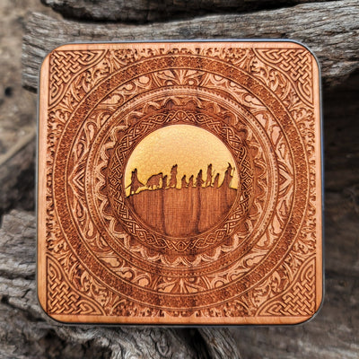 Dark wood wireless charger featuring Middle-earth symbols.