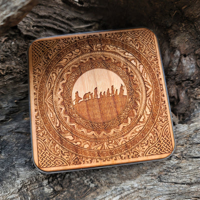 Fantasy desk with Lord of the Rings Fellowship wireless charger.