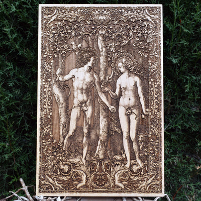 Engraved Adam and Eve wood artwork – handcrafted biblical decor for Christian homes.