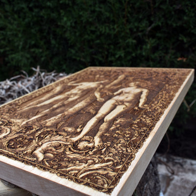 Handmade Adam and Eve Christian wall art – wood engraving with intricate details.