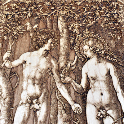 Religious wood wall art featuring Adam and Eve – engraved Christian home decor.