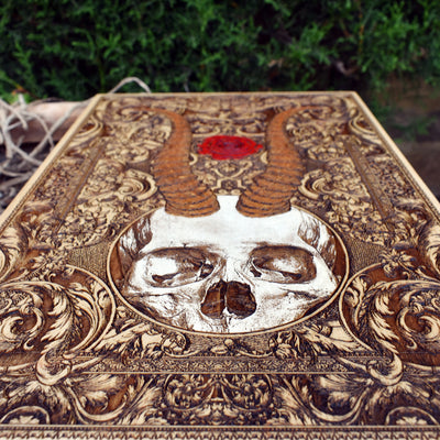 Macabre wood engraving of horned skull, ideal for skull collectors.