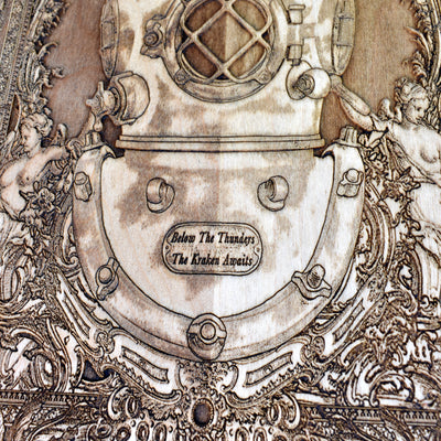 Ocean-inspired laser-engraved wooden artwork of a deep-sea diver’s helmet and the Kraken from maritime legends.