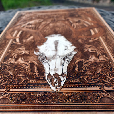 Custom engraved deer skull on wood panel, ideal wall art for lodge or hunting cabin.
