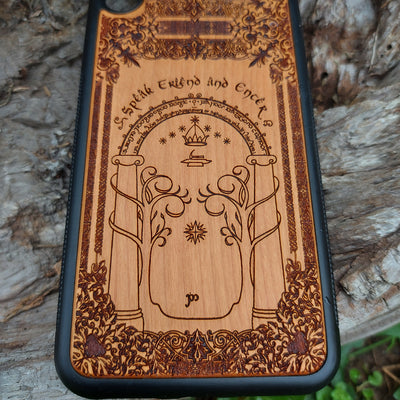 Beautifully engraved wood phone case featuring the iconic Doors of Durin design from Lord of the Rings, compatible with iPhone , Samsung Galaxy S, and other models. Handcrafted with intricate detailing for fans of Tolkien's Middle-earth.