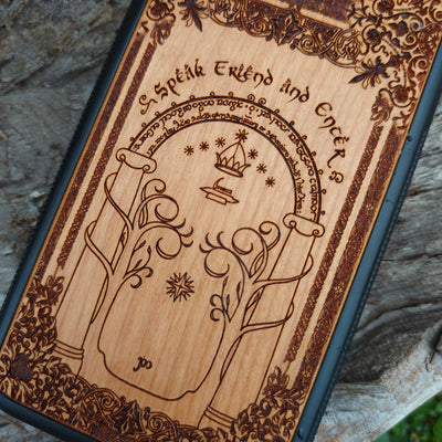 Beautifully engraved wood phone case featuring the iconic Doors of Durin design from Lord of the Rings, compatible with iPhone , Samsung Galaxy S, and other models. Handcrafted with intricate detailing for fans of Tolkien's Middle-earth.