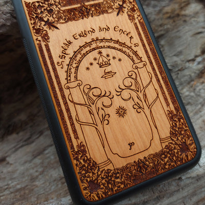 Beautifully engraved wood phone case featuring the iconic Doors of Durin design from Lord of the Rings, compatible with iPhone , Samsung Galaxy S, and other models. Handcrafted with intricate detailing for fans of Tolkien's Middle-earth.