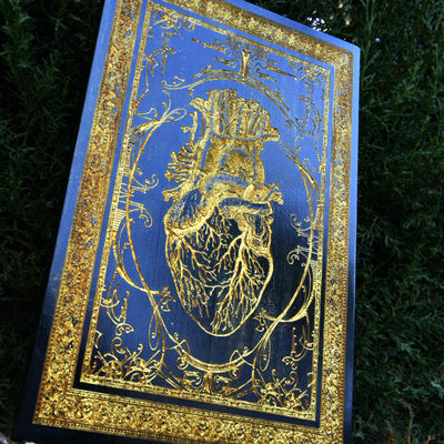 Laser-engraved anatomical human heart on wood, perfect alternative love gift.