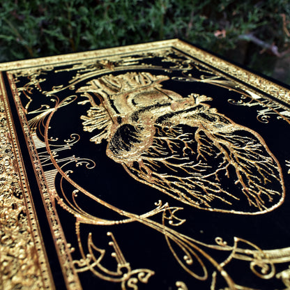 Detailed human heart engraving on wood, ideal for anatomy art collectors.