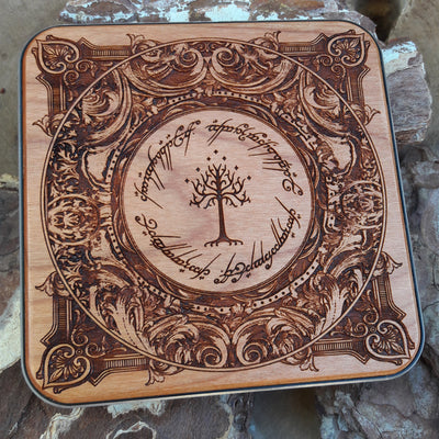 Close-up of Tolkien-inspired elven script on wooden wireless charger.