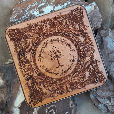 Side angle of Middle-earth symbols engraved on wood charger.