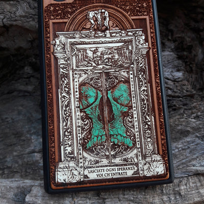Hand-painted and laser-engraved "Hell Gate II" wooden phone case depicting a demonic skull on cherrywood. Compatible with iPhone -11 Pro Max and Galaxy S-S20 models.