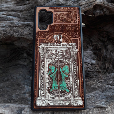 Hand-painted and laser-engraved "Hell Gate II" wooden phone case depicting a demonic skull on cherrywood. Compatible with iPhone -11 Pro Max and Galaxy S-S20 models.