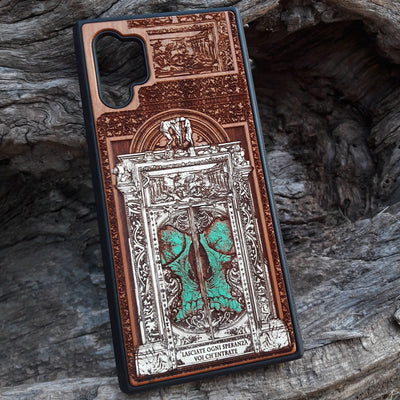 Hand-painted and laser-engraved "Hell Gate II" wooden phone case depicting a demonic skull on cherrywood. Compatible with iPhone -11 Pro Max and Galaxy S-S20 models.