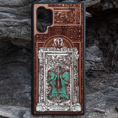 Hand-painted and laser-engraved "Hell Gate II" wooden phone case depicting a demonic skull on cherrywood. Compatible with iPhone -11 Pro Max and Galaxy S-S20 models.