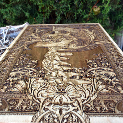 Engraved wooden screaming skull artwork, perfect for macabre home decor and gothic enthusiasts.