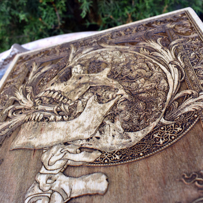 Detailed skull and spine wood engraving, a horror-themed masterpiece for dark and gothic decor.