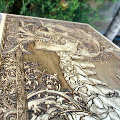 Unique gothic skull wood decor featuring a screaming face and spine, a bold statement piece.