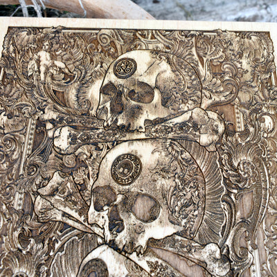 Laser-engraved skull design on wood, vintage gothic style