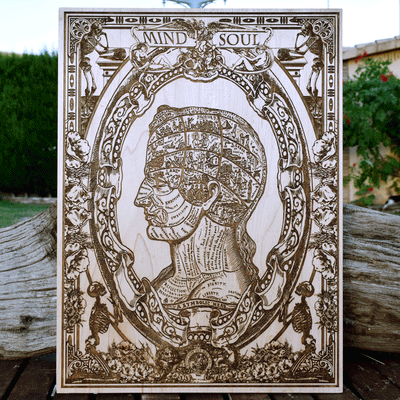 Vintage wood wall art with engraved symbolical human head design.