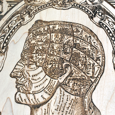 Symbolical head wood decor with engraved surreal details.
